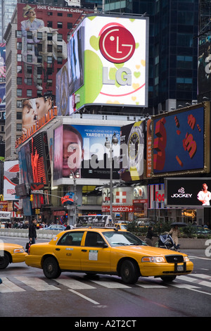 Yellow cab and Bertelsmann Building Times Square New York City USA Stock Photo