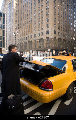 Passenger leaving a yellow cab New York City USA Stock Photo