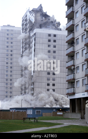 Tower block demolition using controlled explosives with tower ...