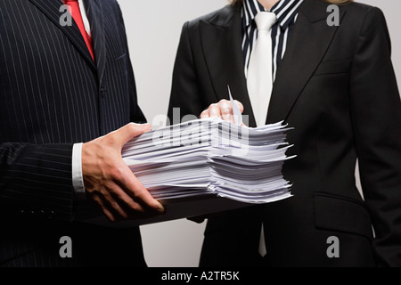 Businessman holding paperwork Stock Photo