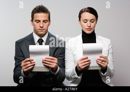 Two colleagues looking at notebook Stock Photo