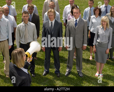 Businesswoman talking to colleagues Stock Photo