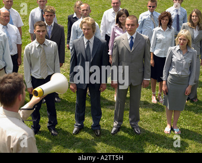 Businessman talking to colleagues Stock Photo