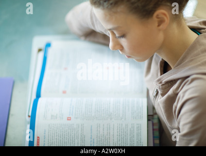 Preteen girl doing homework Stock Photo