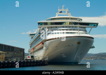 The Diamond Princess world s largest cruise liner moored in Hobart Tasmnia dwarfs the dockside sheds Stock Photo