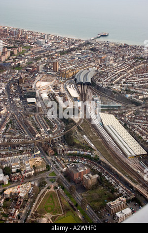 Aerial view of Brighton city centre from north showing A23 and railway station with pier and sea Stock Photo