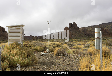 stevenson screen anenometer and Rain gauge instruments in weather monitoring station near El Teide mountain Tenerife Canary Islands Spain Stock Photo