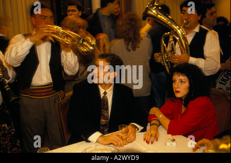 Belgrade under sanctions  A couple listen to traditional musicians at  an International Press Club pre-election event, Dec 1993 Stock Photo
