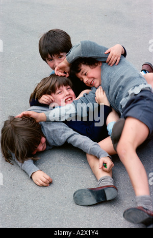 School Playground Boys Play Fighting Stock Photo - Alamy