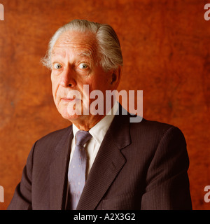 Studio portrait of old man in business suit. Stock Photo