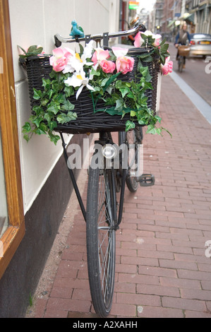 Amsterdam Bicycle with Flowers on Basket Stock Photo