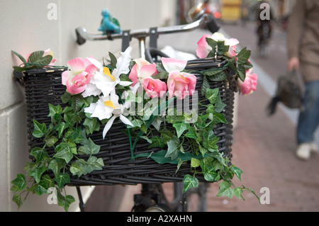 Amsterdam Bicycle with Flowers on Basket Stock Photo