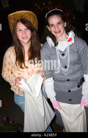 Masked trick or treaters with a red Roblox prime gaming shirt and a  Halloween ghoul in costume. St Paul Minnesota MN USA Stock Photo - Alamy