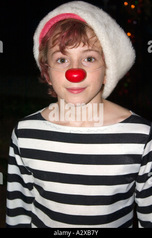 Halloween trick or treater clown with red nose age 14. St Paul Minnesota USA Stock Photo