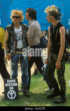 1980s Punks at CND logo symbol  Campaign for Nuclear Disarmament Rally in 'Hyde Park' London  1982 UK HOMER SYKES Stock Photo