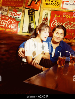 Young Asian couple in bar. Stock Photo