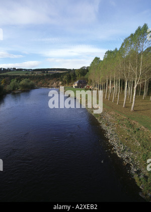 dh  RIVER TWEED BORDERS Anglers fishing from boat near river bank houses line of trees and farm footpath scotland path country scottish lowlands Stock Photo