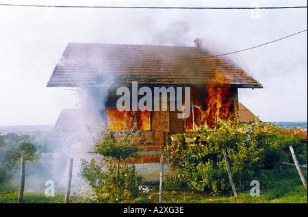 Croatian re-capture of Krajina, Aug 95: A house burns in Petrinja. Stock Photo