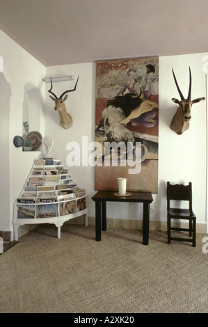 Bullfighting poster next to stuffed animal heads in Ernest Hemingway's home in Cuba Stock Photo