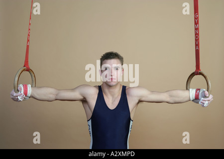 man on rings doing crusifix,Olympics 2012 Stock Photo