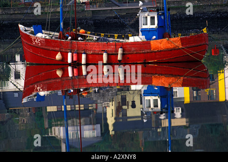 IRELAND COUNTY CORK KINSALE Colorful fishing boats reflecting in harbour Stock Photo