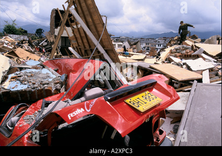 Earthquake in Colombia 1999 -  the poor areas of Armenia were worse hit . A soldier  with a sniffer dog search rubble for people Stock Photo