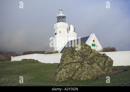 St Catherine's Lighthouse Towers Isle of Wight  Mist and cloud floor above 200ft hiding background hills Stock Photo