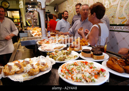 Eating tapas at a bar in San Sebastian, Spain Stock Photo