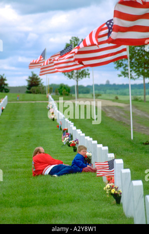 Dad and son at Fort Snelling Military Cemetery on Memorial Day age 30 and 4. Minneapolis Minnesota USA Stock Photo