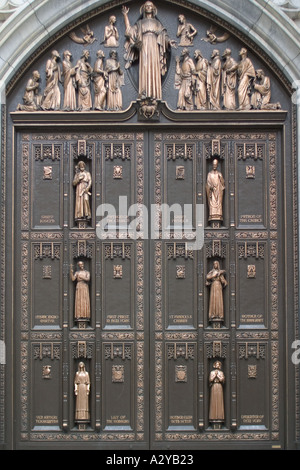 Depictions of saints on a door of St Patricks Cathedral New York USA Stock Photo