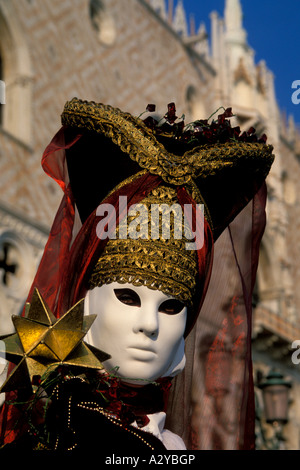 Costume of Brown, Gold and Maroon for Carnevale in Venice, Italy Stock Photo