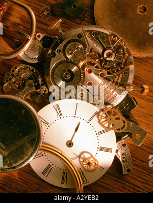 Watch parts on wood table top Stock Photo