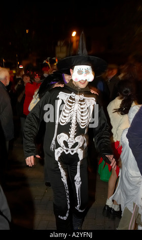 people in fancy dress do the conga dance through the crowd in guildhall square Halloween Derry Ireland Stock Photo