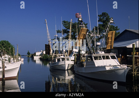 North Carolina Outer Banks Harkers Island commercial fishing boats docked in inlet Stock Photo