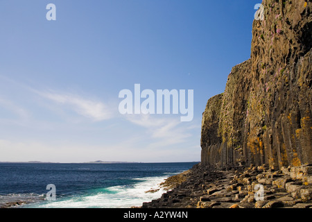 Isle of Staffa in summer sun sunshine with blue sky showing basalt columns and path to Fingals Cave Strathclyde Scotland