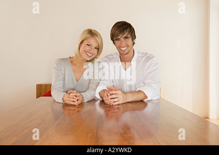 Young couple sitting at table Stock Photo