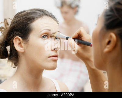 Model having make-up done Stock Photo