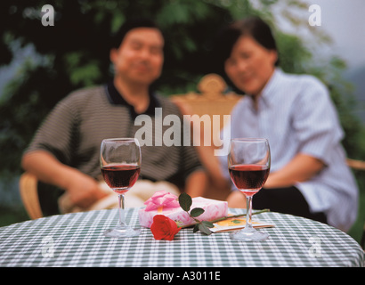 Chinese mature couple sitting on a bench Stock Photo