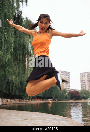 a chinese young woman upspring Stock Photo
