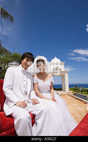 Newlyweds on horsedrawn carriage Stock Photo