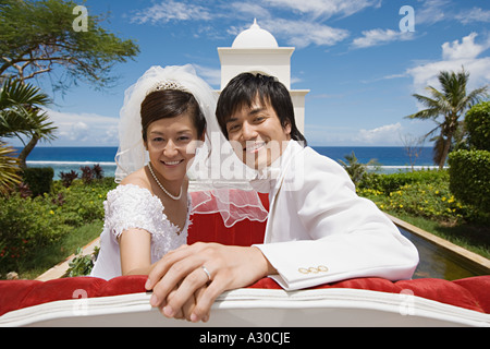 Newlyweds on horsedrawn carriage Stock Photo