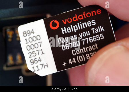 Vodafone company Sim card in mobile telephone England UK Stock Photo