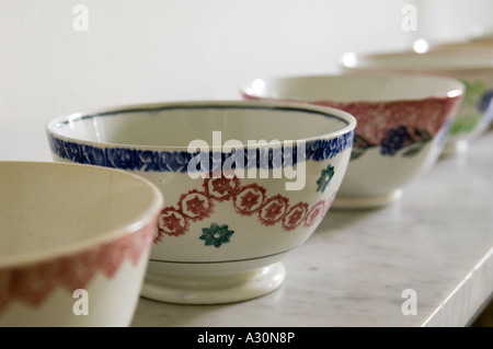 Hand painted bowls on a marble shelf Stock Photo