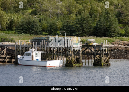 The lobster boat ALICE B lies alongside the wharf at Burn Island in the Georges Islands of Muscongus Bay, Maine Stock Photo