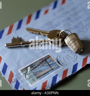 Close up of keys with a thimble keyring on a letter Stock Photo