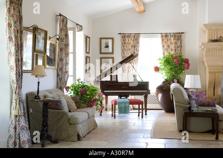 Grand piano in living room with sofas Stock Photo