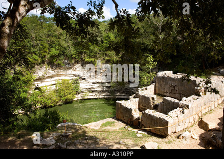 Cenote a sacred well used for human sacrifice at the ruined Mayan city of Chichen Itza in Mexico Stock Photo