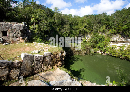 Cenote a sacred well used for human sacrifice at the ruined Mayan city of Chichen Itza in Mexico Stock Photo