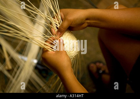 Woman braiding the famous panama straw hats in a traditional cave in Becal Mexico Stock Photo