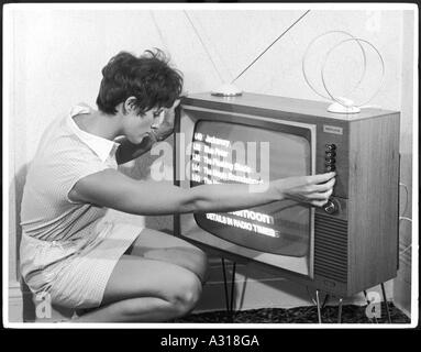 Adjusting A Tv Set Stock Photo